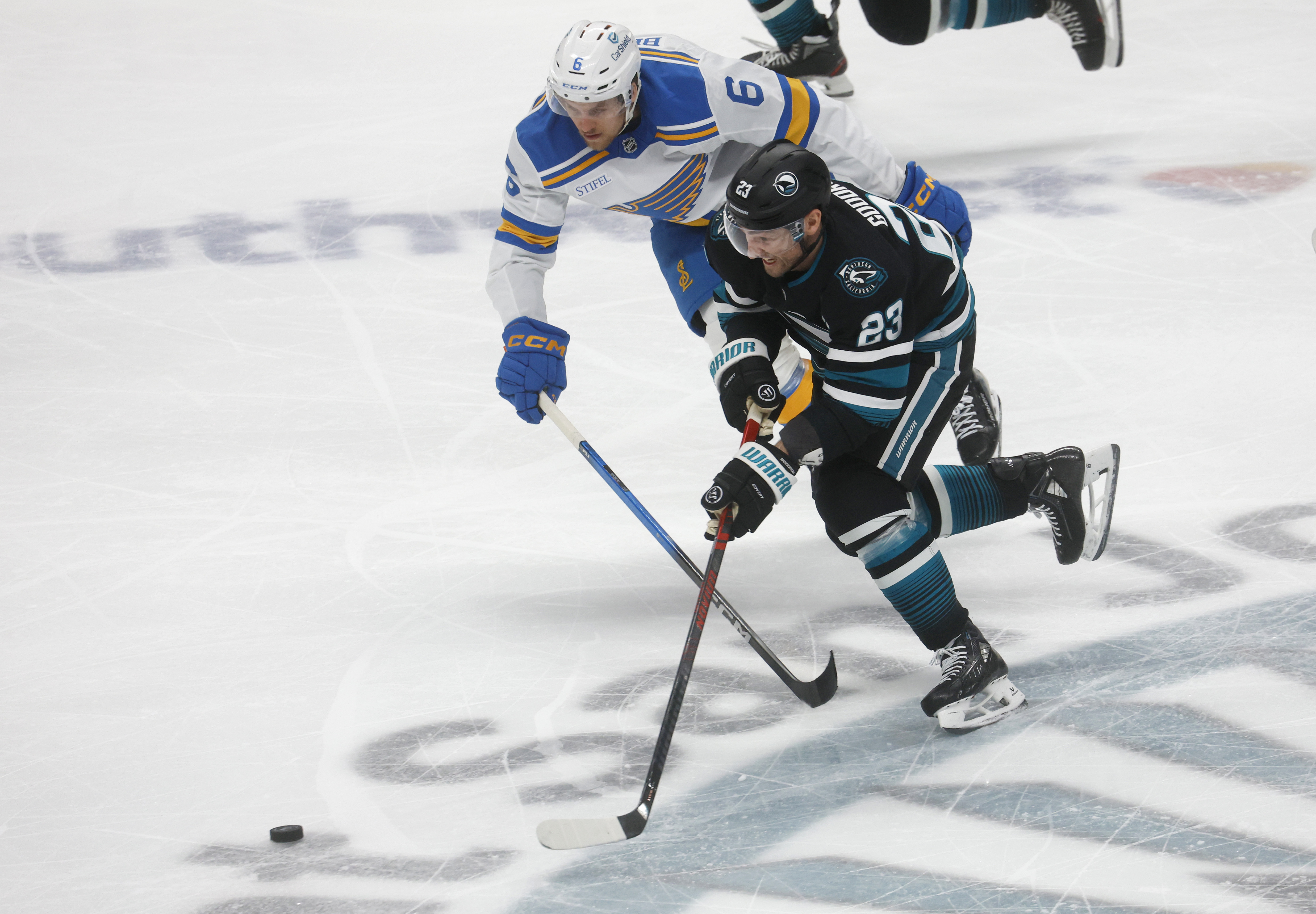 San Jose Sharks' Barclay Goodrow (23) fights for the puck...