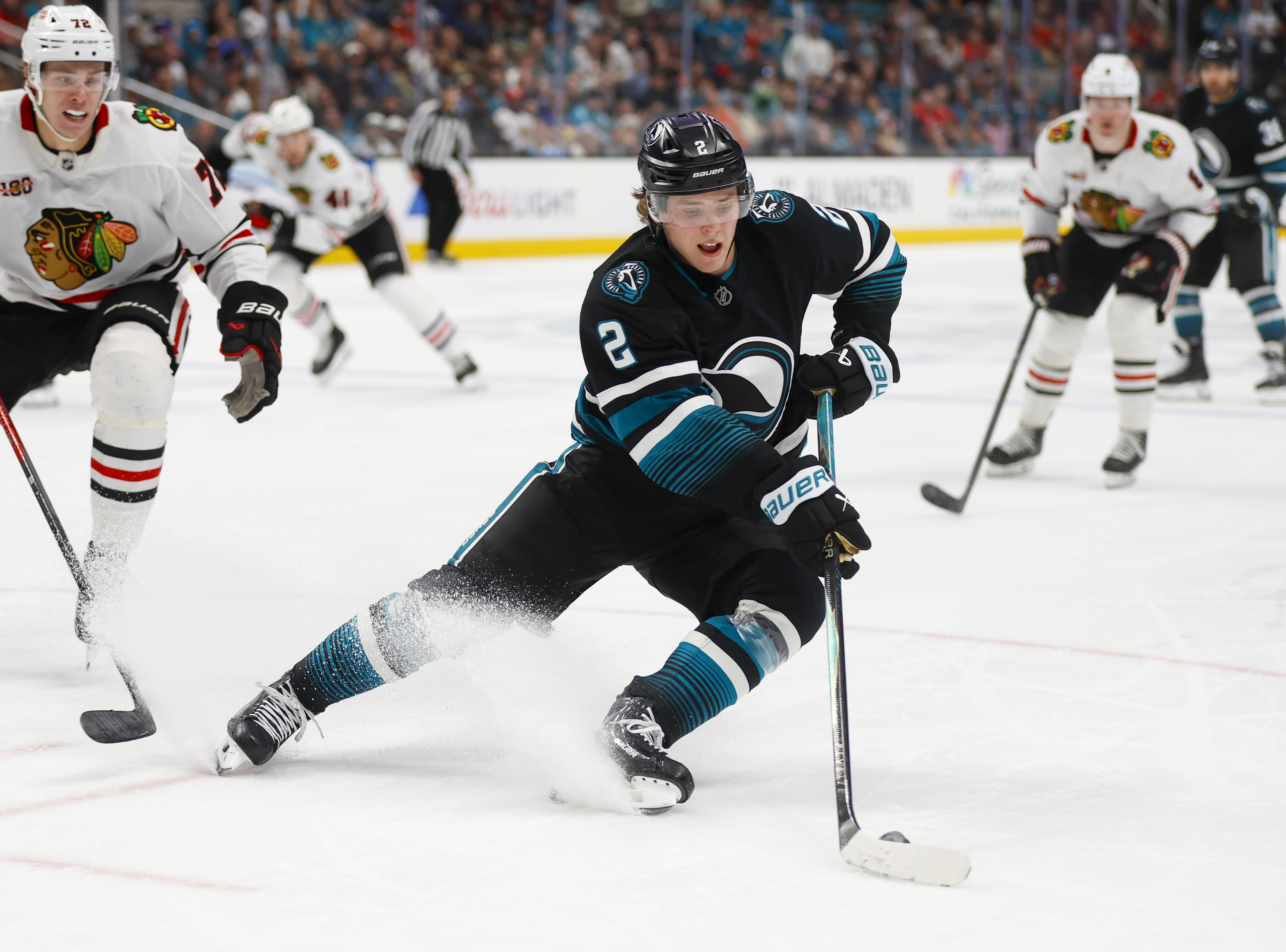 San Jose Sharks’ Will Smith (2) controls the puck against...