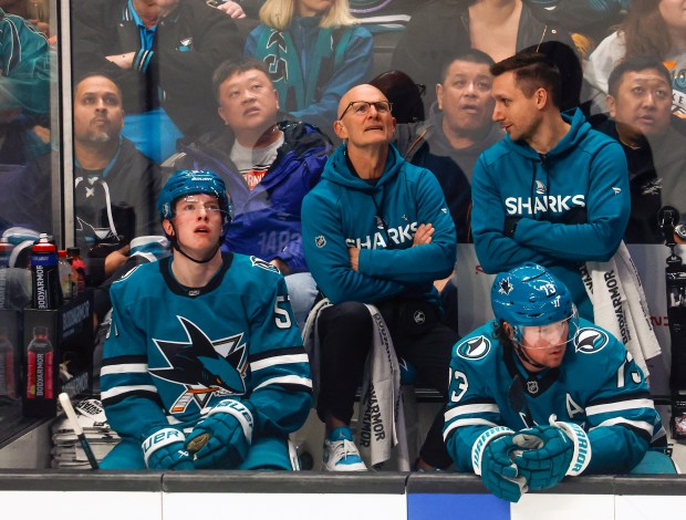 Mike Aldrich, center, equipment manager, sits on the bench during his last game in the second period at SAP Center in San Jose, Calif., on Saturday, April 11, 2026. (Shae Hammond/Bay Area News Group)