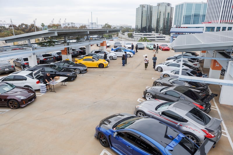 Car meet on top of a parking lot