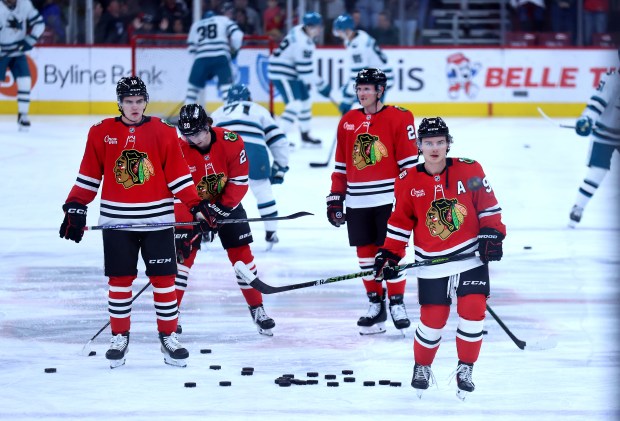 Chicago Blackhawks center Connor Bedard (right) and his teammates warm up for a game against the San Jose Sharks at the United Center in Chicago on April 15, 2026. (Chris Sweda/Chicago Tribune)