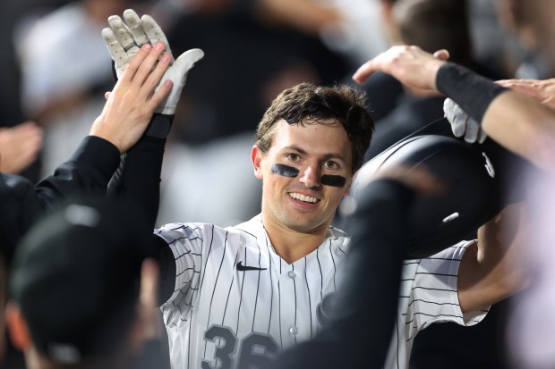Chicago White Sox catcher Drew Romo is congratulated by his teammates in the dugout after hitting a two-run home run in the fourth inning of a game against the Los Angeles Angels at Rate Field in Chicago on April 28, 2026. (Chris Sweda/Chicago Tribune)