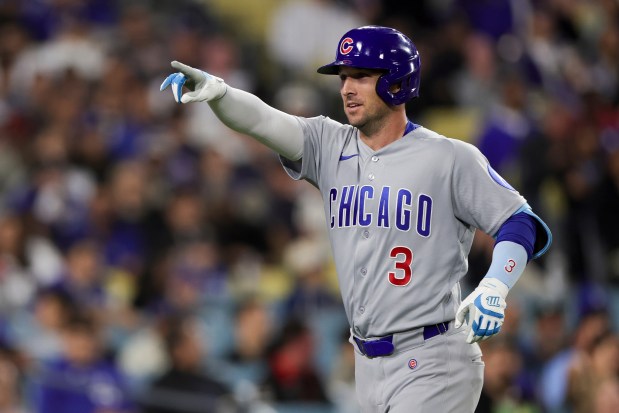 Cubs third baseman Alex Bregman points to the dugout after hitting the tying home run during the eighth inning against the Dodgers on Friday, April 24, 2026, in Los Angeles. (Ryan Sun/AP)