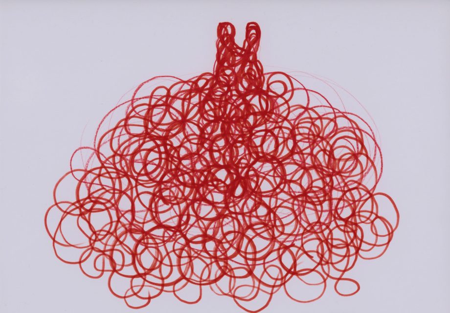 Red loops of ink or marker form a dense, tangled scribble resembling an abstract or stylized pom-pom shape on a plain white background.