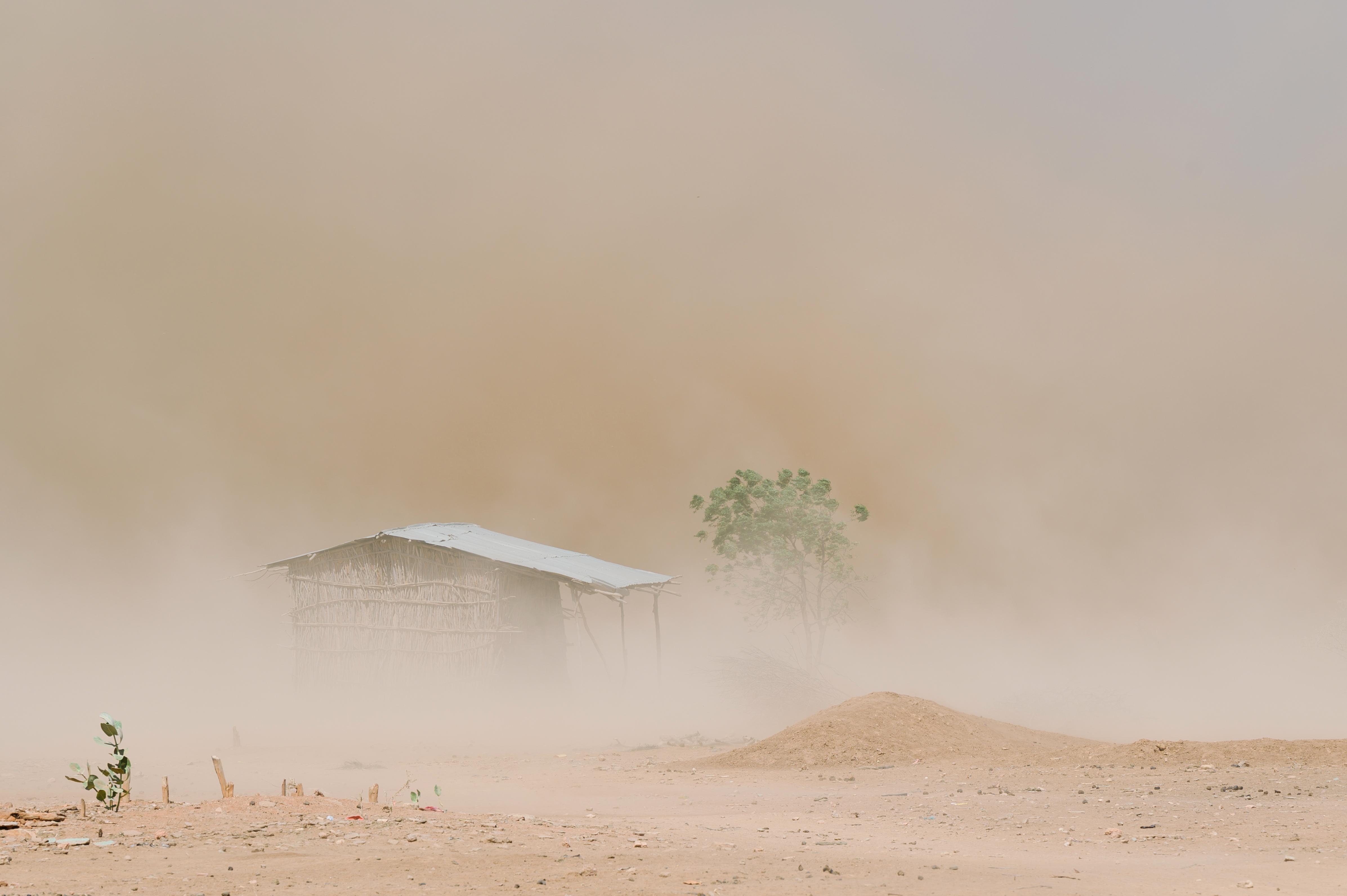Dust engulfs a home.