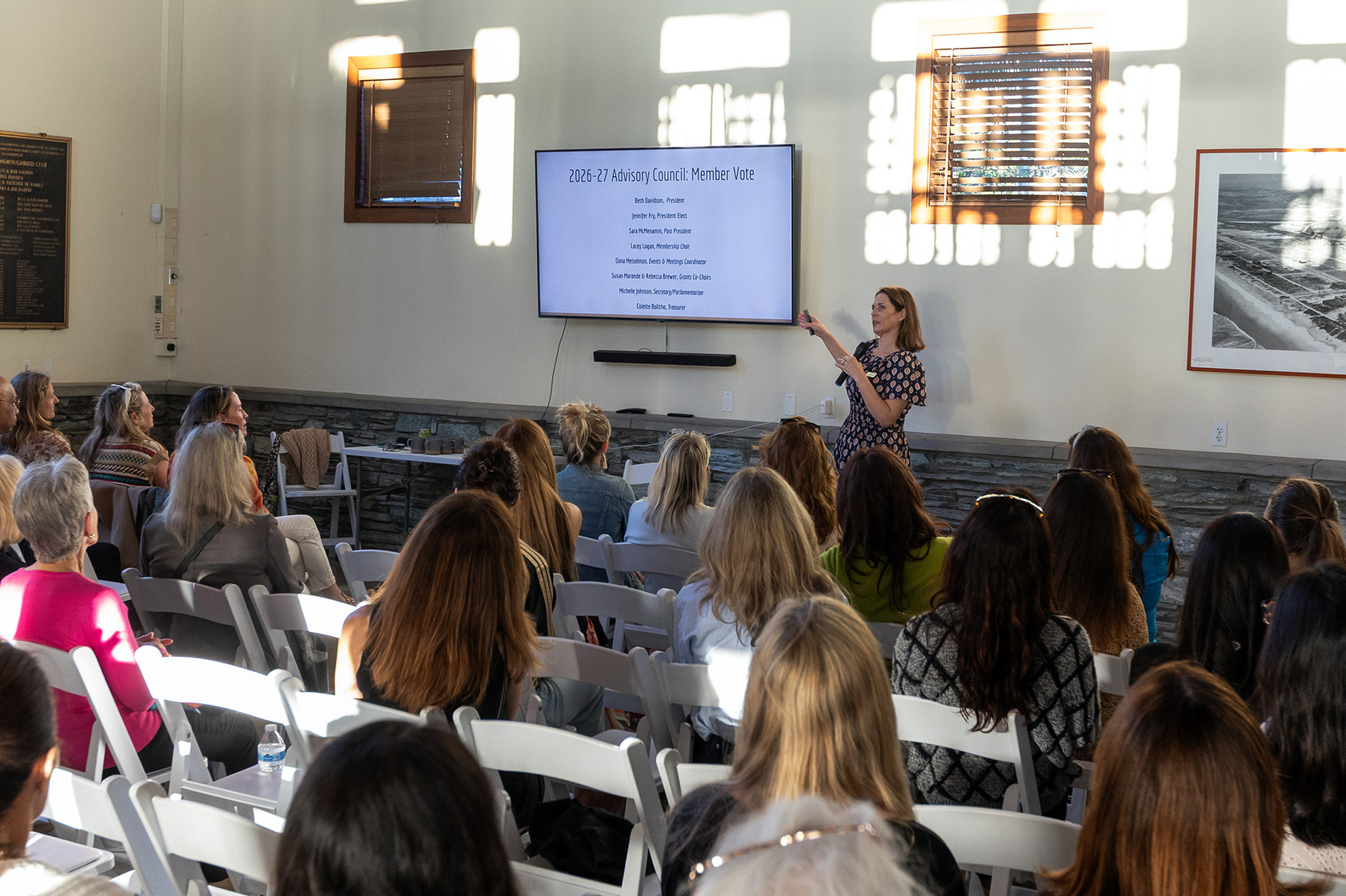 Sara McMenamin opens the meeting in the Del Mar Powerhouse...