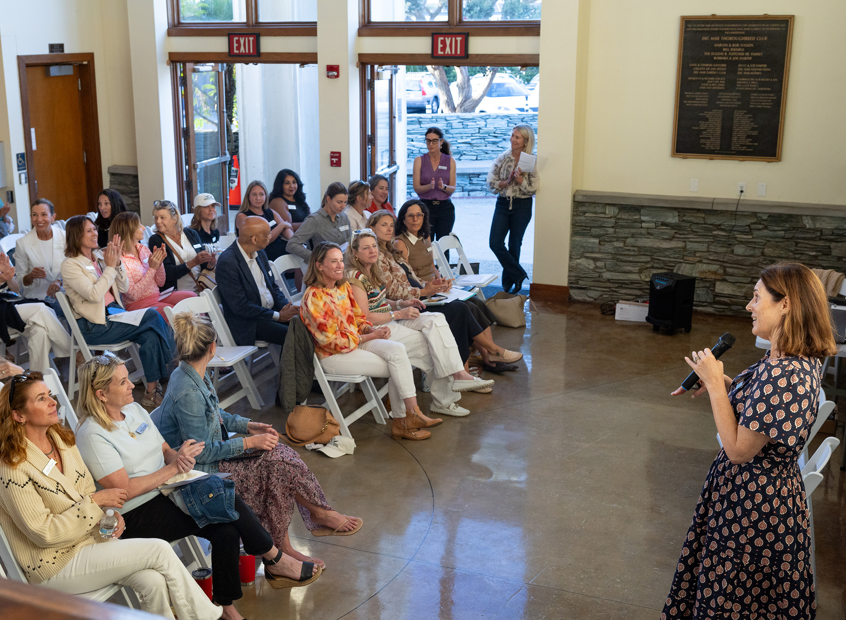 Sara McMenamin opens the meeting in the Del Mar Powerhouse...