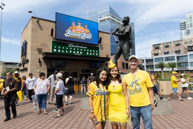 Eva Mather and her parents Qian and Brian at Petco Park for the Savannah Bananas game. (Courtesy Qian Mather)