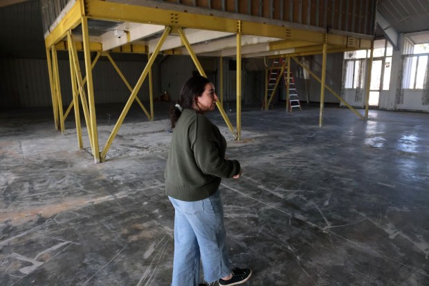 Teale Harden the Executive Director of the Alameda Food Bank walks through the organizations building across the street from their current operation on Wednesday, Nov. 6, 2024, in Alameda, Calif. The food bank, which serves fresh produce, meats, and more to around 1,300 families a week hopes to move into a new facility built on the site at the former Naval Air Station. (Aric Crabb/Bay Area News Group)
