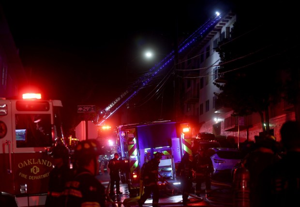 Oakland firefighters respond to a two-alarm fire in a large apartment building at 200 Fairmount Avenue in Oakland, Calif., on Tuesday, April 7, 2026. (Jane Tyska/Bay Area News Group)