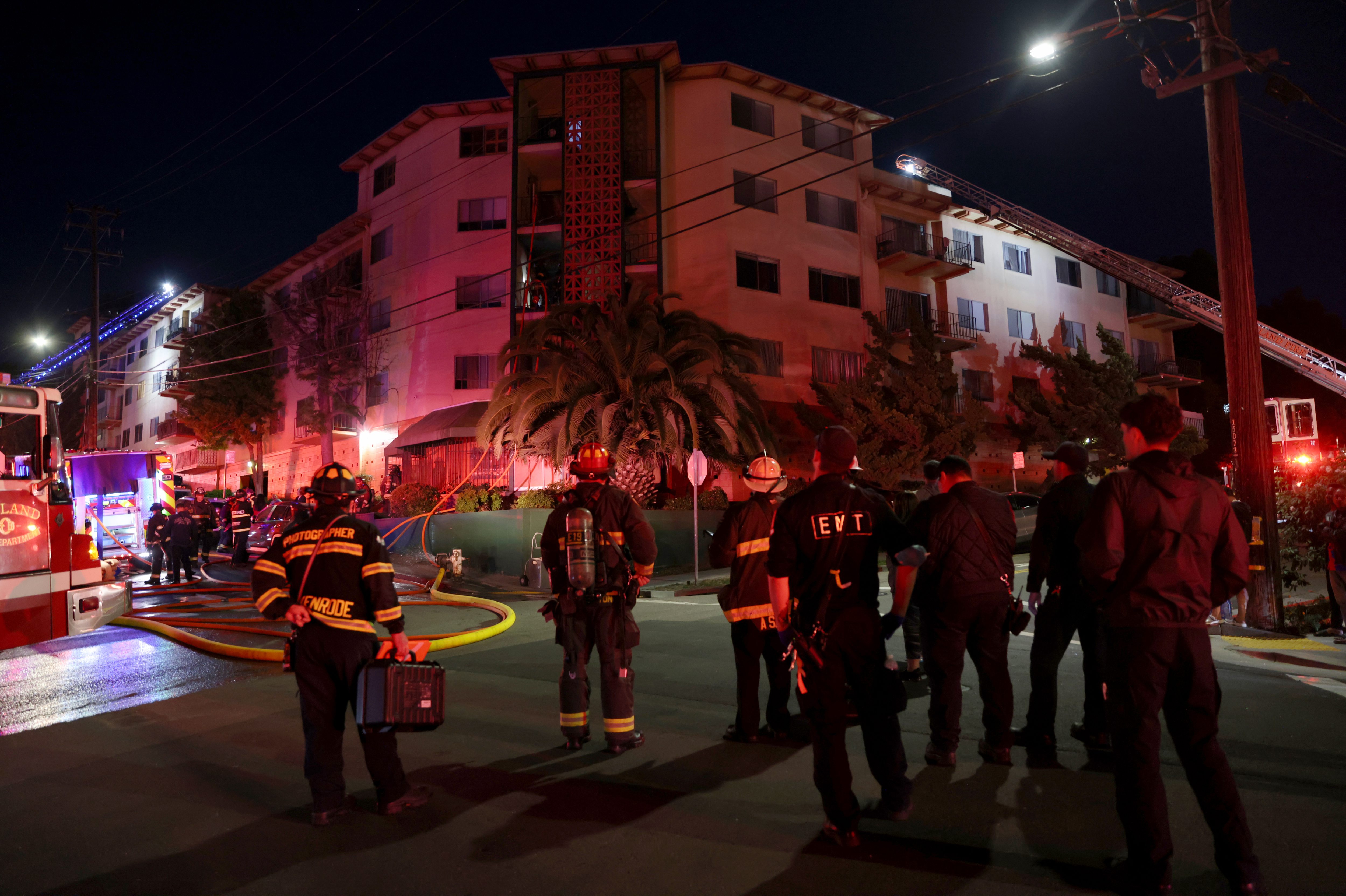 Oakland firefighters respond to a two-alarm fire in a large...