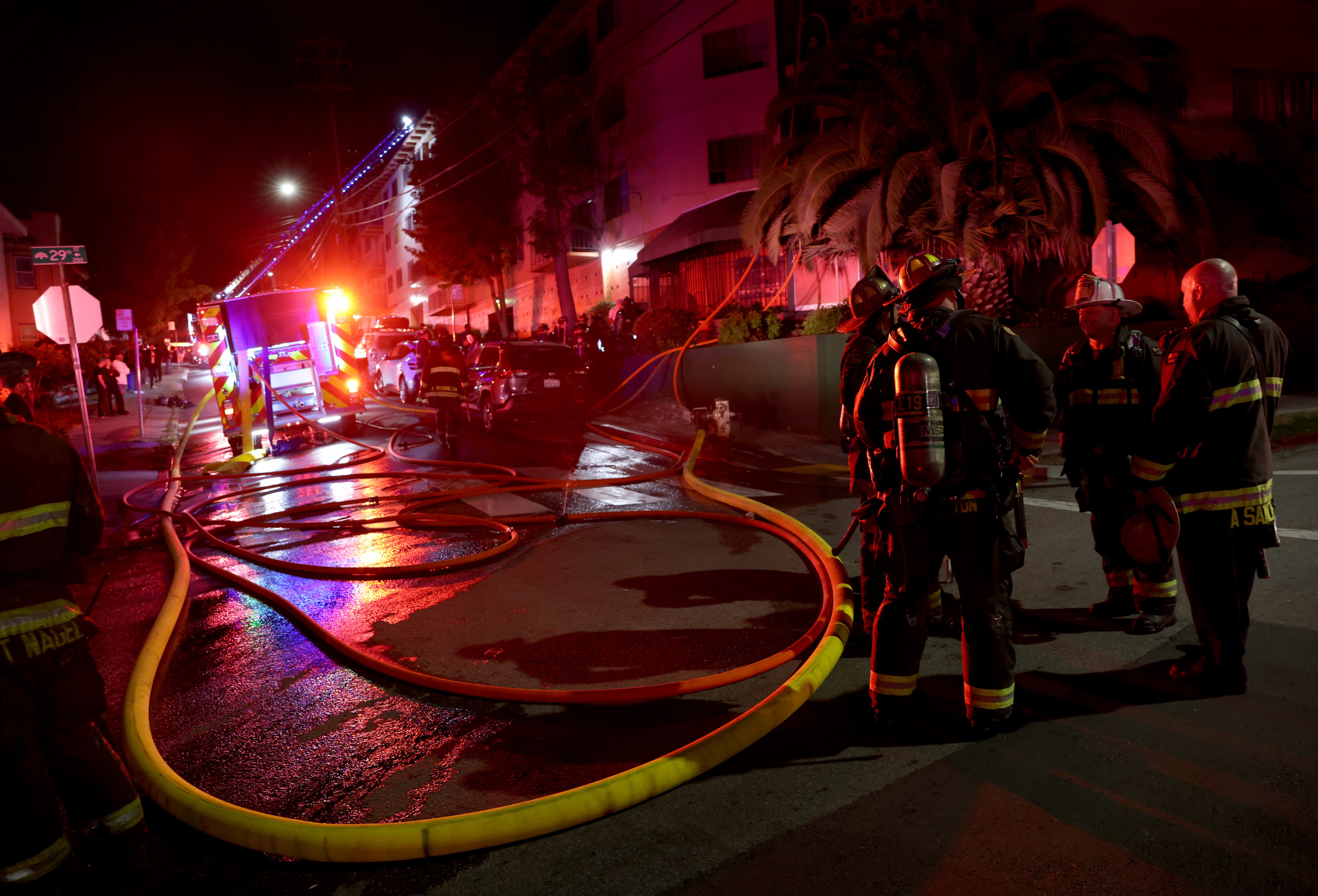 Oakland firefighters respond to a two-alarm fire in a large...