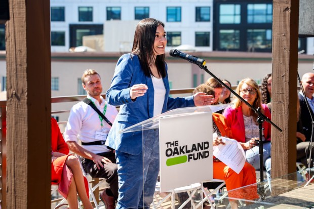 Oakland Fund CEO Kyra Mungia speaks during a ribbon-cutting ceremony for the 33-unit Idora Building in Oakland, Calif., on Thursday, April 2, 2026. The Oakland Fund, through its Rooted educator housing program, purchased the building to provide affordable housing for OUSD teachers and school employees. (Ray Chavez/Bay Area News Group)