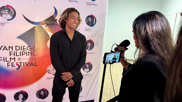 Encinitas surfer Titus Santucci is interviewed at the San Diego Filipino Film Festival. (Irene Navarro)