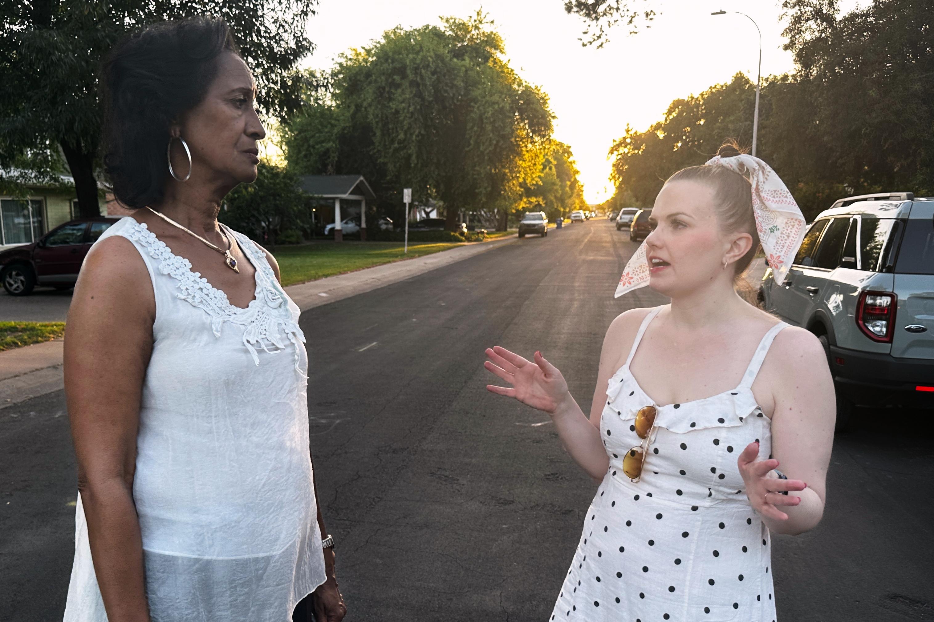 Sandra Kennedy and Casey Clowes speak while canvassing in Tempe, Arizona.