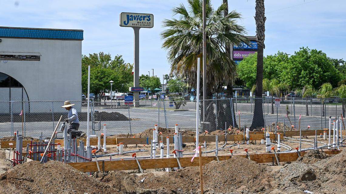 Workers begin construction on a new Dutch Bros Coffee store going up near the old Javier's on Kings Canyon east of Clovis Avenue on Wednesday, April 15, 2026.