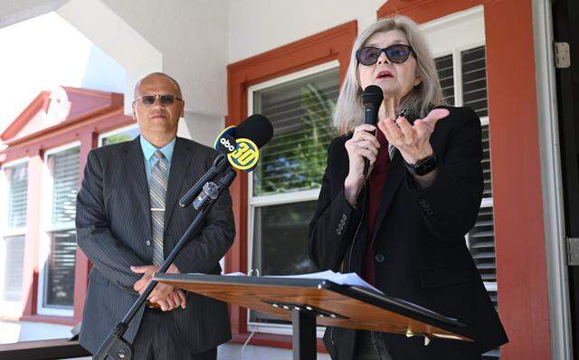 Emily Brandt, right, addresses the media with attorney Kevin Little to the left, as Brandt offers an update of the latest FUSD retirees lawsuit over health benefits coverage during a press conference, Friday, April 3, 2026 in Fresno.
