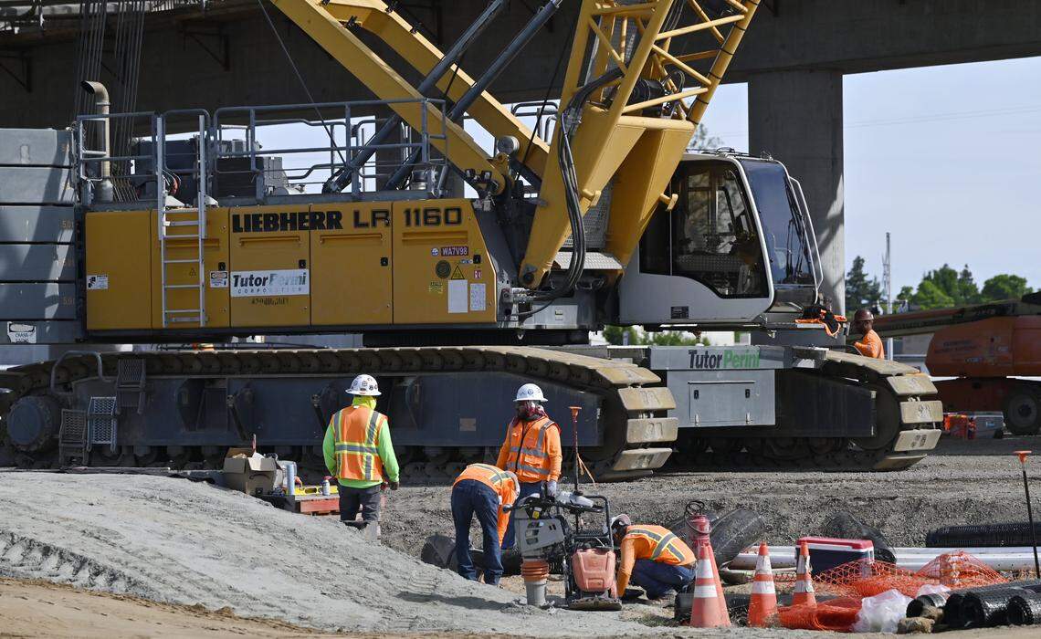 Workers continue construction on High Speed Rail infrastructure near Shaw Avenue, seen during a tour of HSR work Wednesday, April 15, 2026 in Fresno.