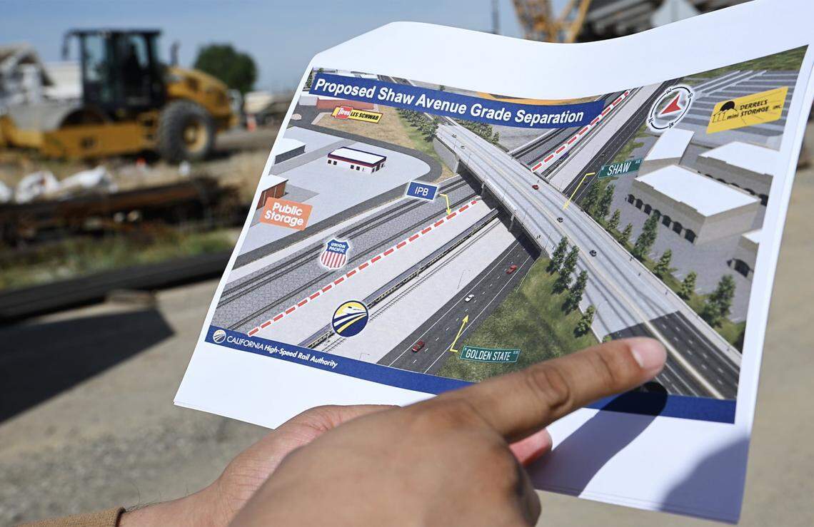 High Speed Rail public information officer Augie Blancas points out details of the Shaw Avenue Grade Separation Project during a tour of HSR work Wednesday, April 15, 2026 in Fresno. Shaw Avenue will consist of six lanes for vehicular, pedestrian and bicycle traffic once complete.