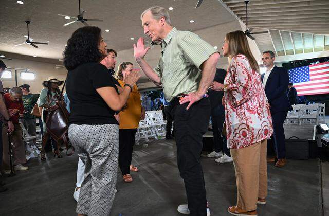California gubernatorial candidate Tom Steyer greets member ean audience member during an appearance Tuesday evening, April 7, 2026 in Fresno.