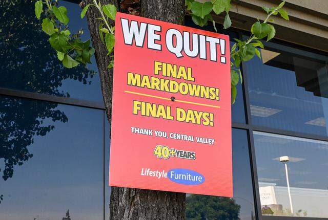 Signs saying “We quit” are posted around the Lifestyle Furniture store at Shaw and Blackstone in Fresno on Wednesday, April 1, 2026. 