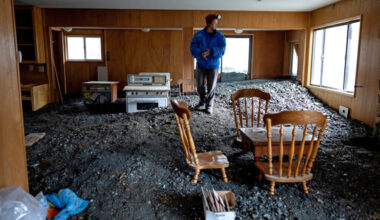 Misty Cheng looks at flood damage to her home in Wrightwood, Calif., on Dec. 25, 2025. Credit: Eric Thayer/Los Angeles Times via Getty Images