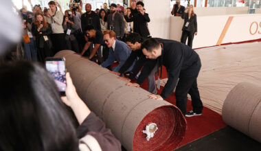 Conan O'Brien helps the crew during the 98th Oscars red carpet roll out at Ovation Hollywood on March 11, 2026 in Hollywood, California.