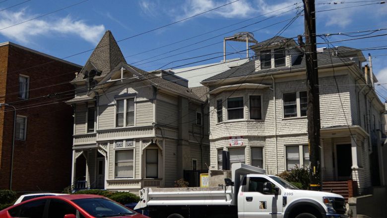 Two older buildings stand next to each other along Durant Avenue.