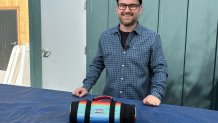 San Diego BurriTote Owner and Operator, Travis Dahl, with his personal BurriTote bag in Kearny Mesa on March 17, 2026. (NBC 7 San Diego)
