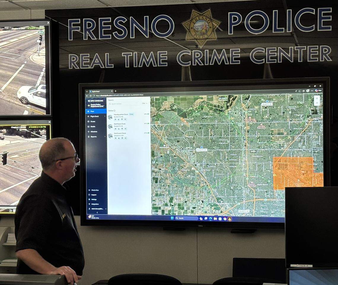 Fresno police Lt. Robert Dewey looks over a map of the city from headquarters. Sections marked in orange are no-fly zones for the drone, including the airport, jail and areas with large antennas.