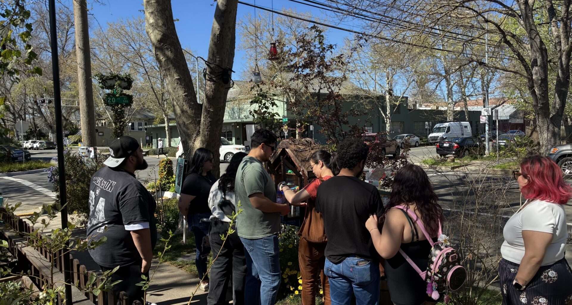 People gathered on the sidewalk.