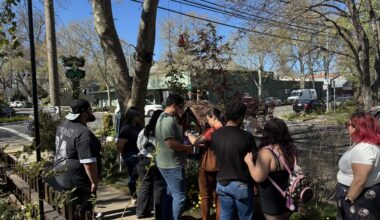 People gathered on the sidewalk.