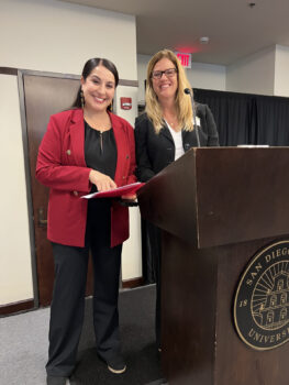 Two professional women at podium