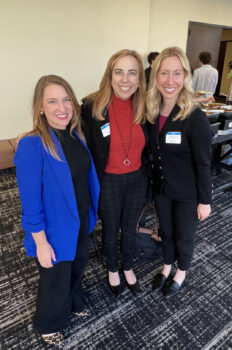 Three professional women standing together