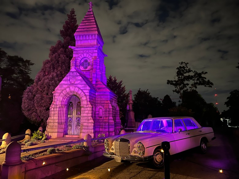 Vintage Mercedes before purple-lit Richards mausoleum at illumine 2025 at Oakland Cemetery Atlanta