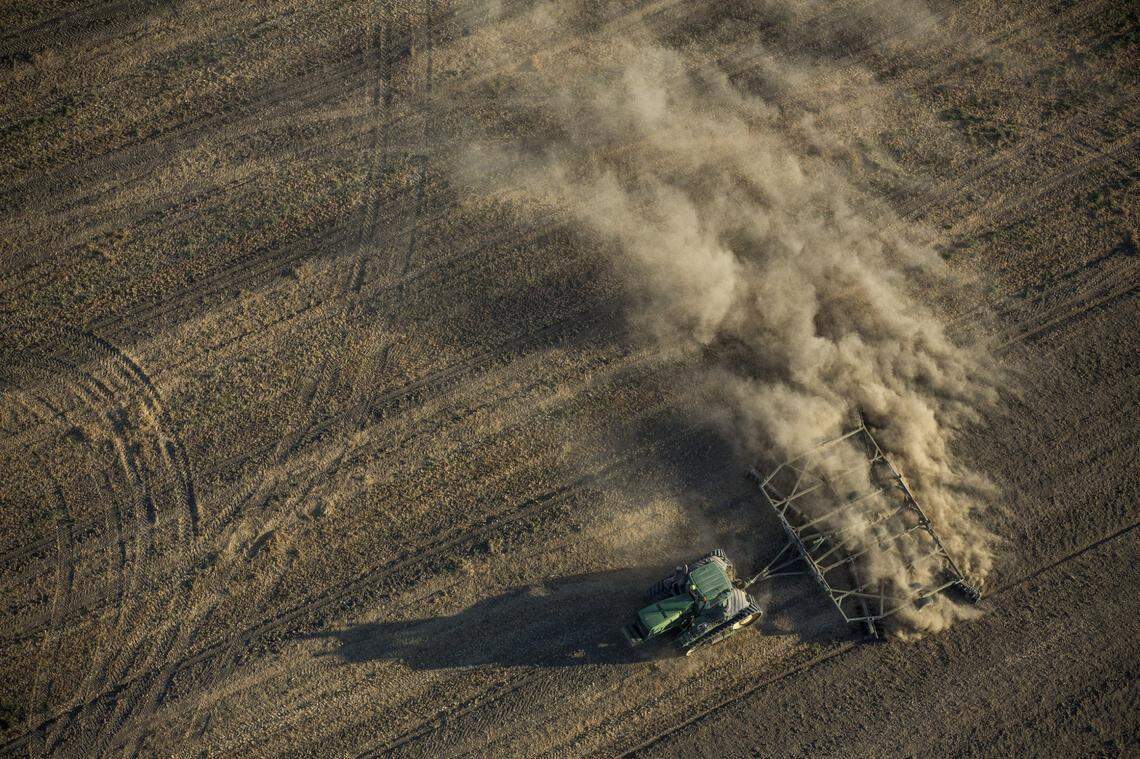 A tractor plows a dusty field in the Westlands Water District west of Fresno.
