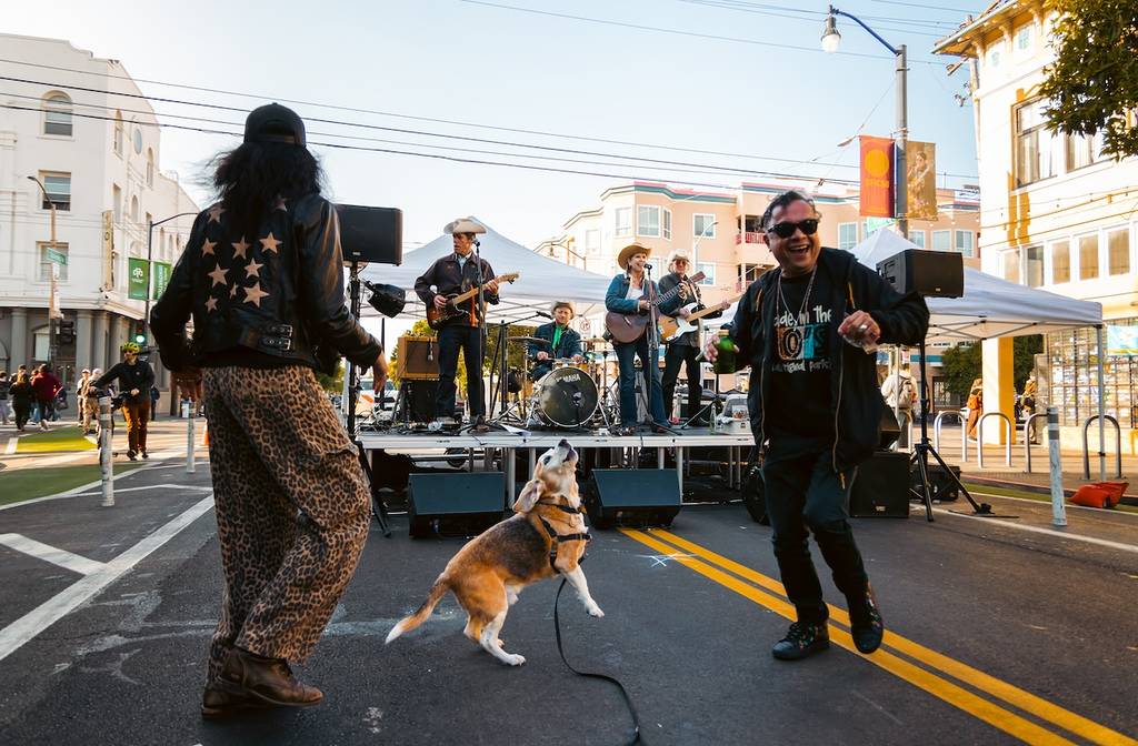 a band performing with people dancing
