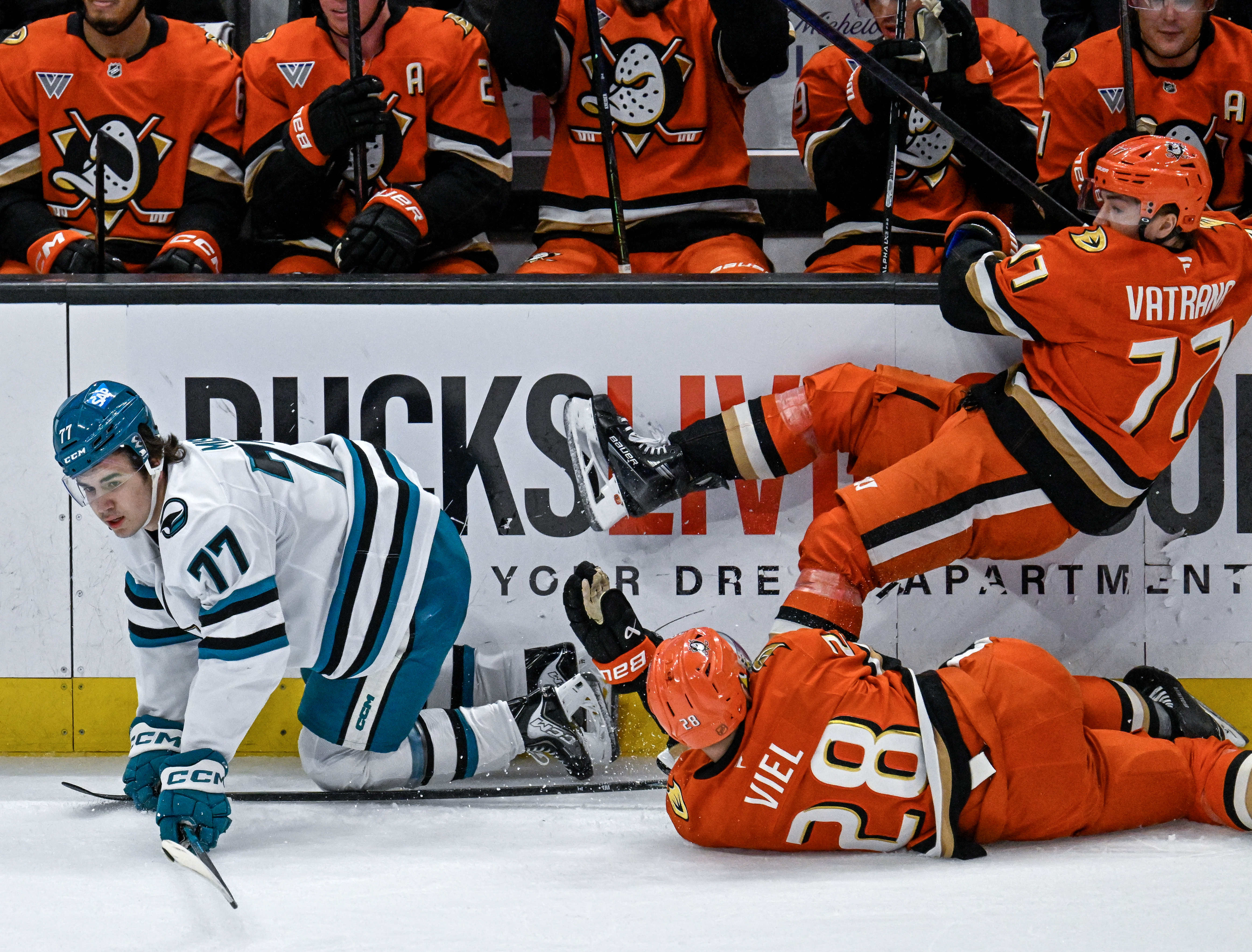The San Jose Sharks’ Michael Misa, left, and the Ducks’...