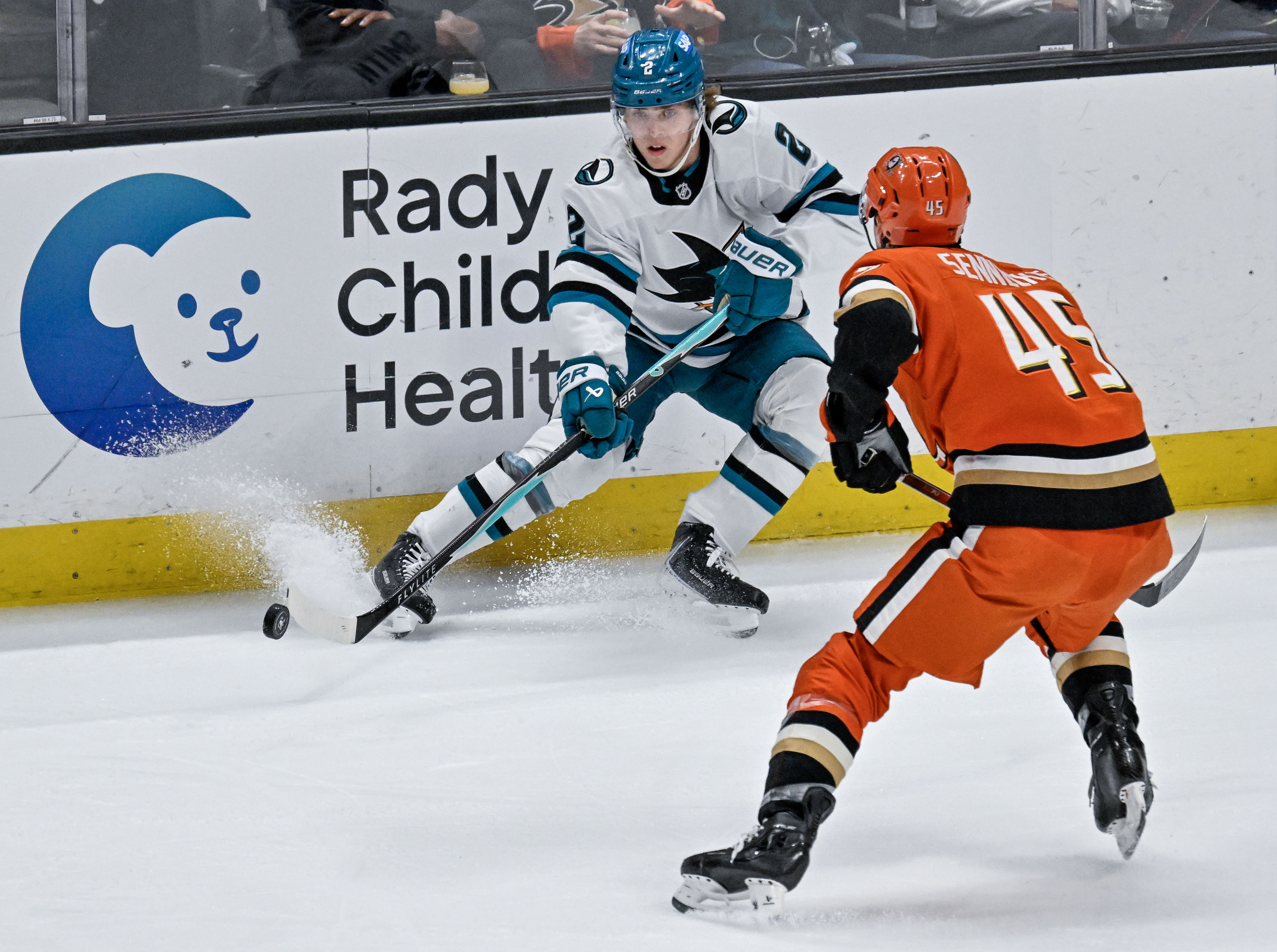 The San Jose Sharks’ Will Smith, left, controls the puck...