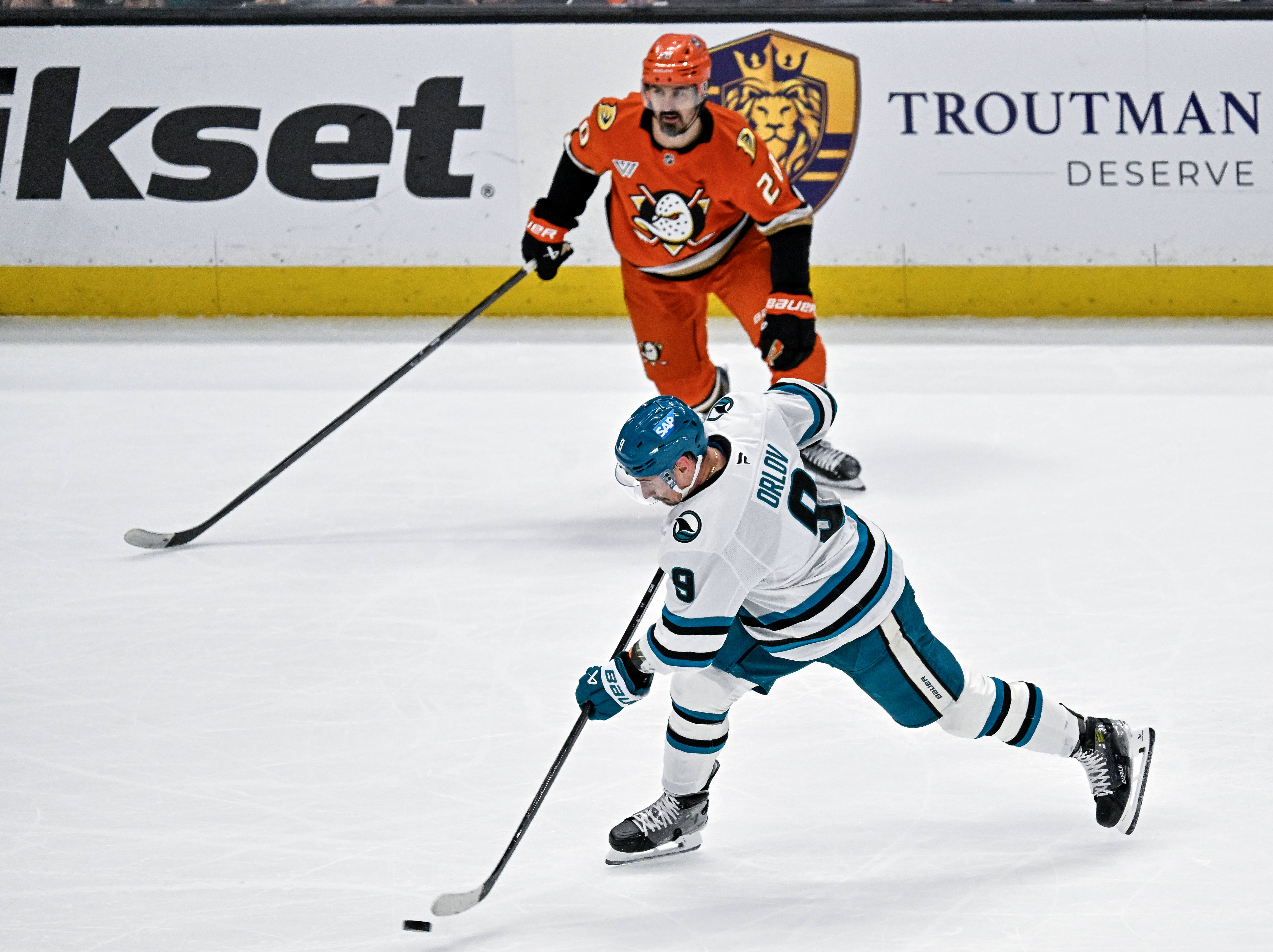 The San Jose Sharks’ Dmitry Orlov, bottom, takes a shot...