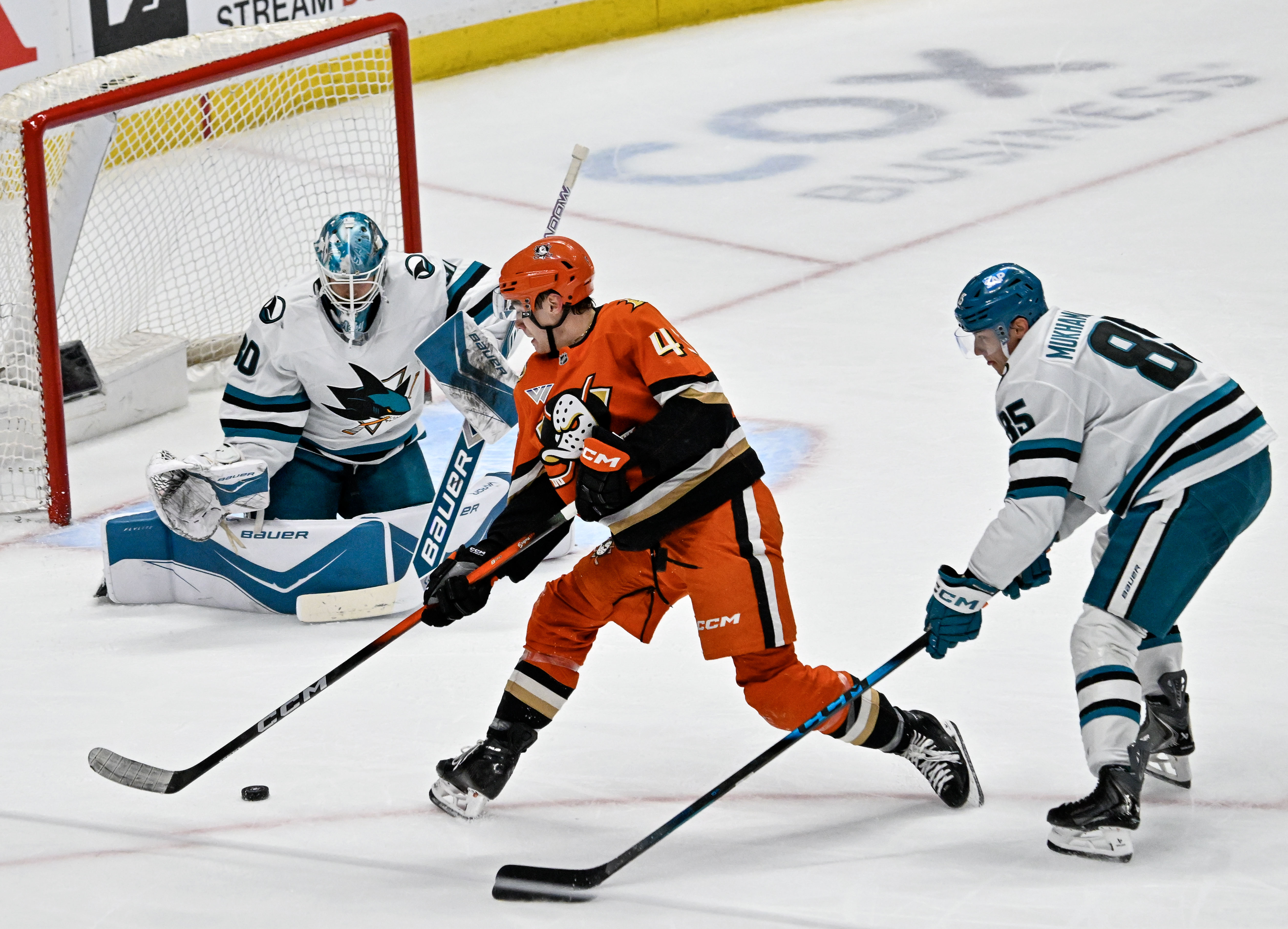The Ducks’ Beckett Sennecke (45) takes a shot on goal...