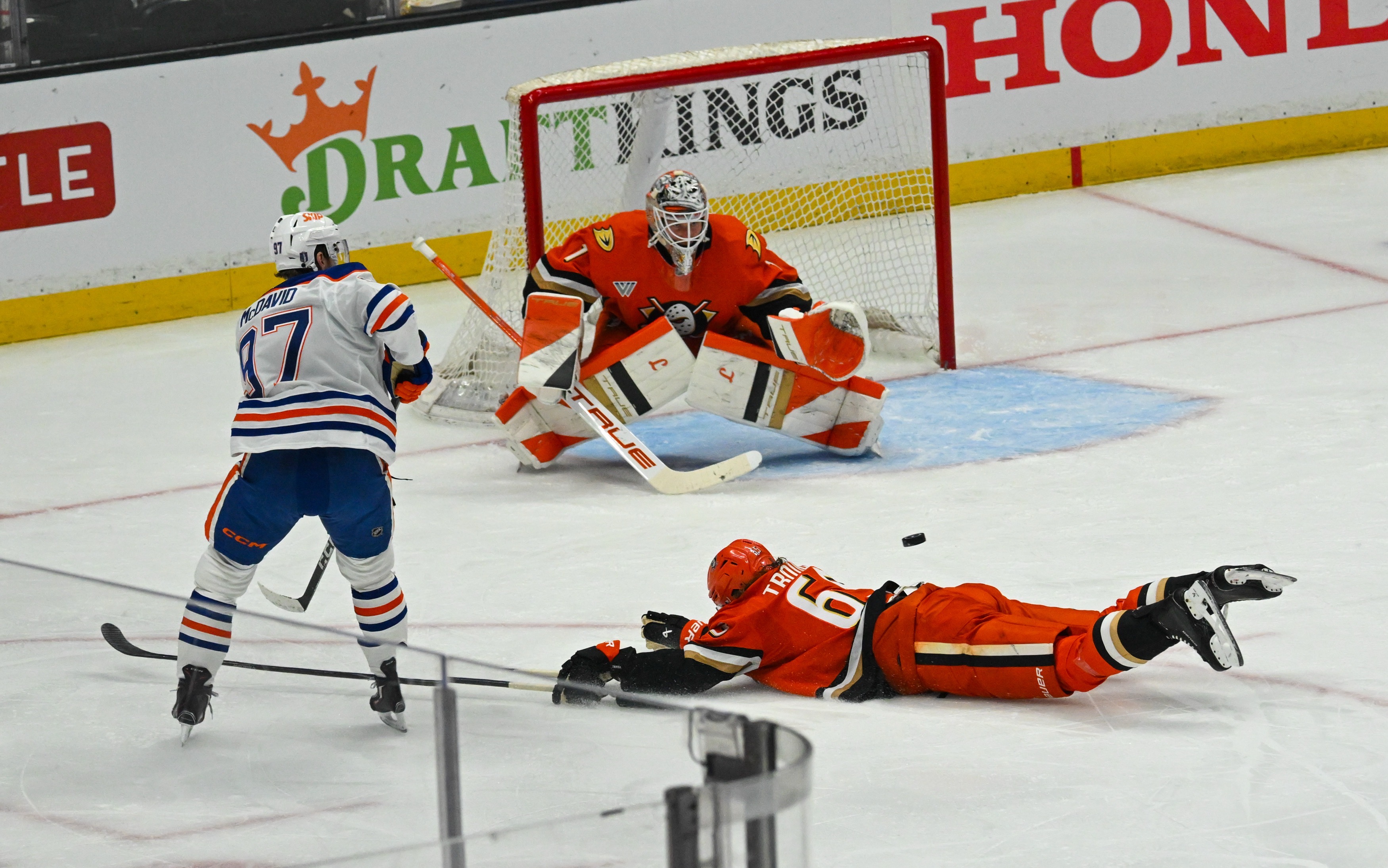 Ducks Lukas Dostal (1) defends against Edmonton Oilers Connor McDavid...