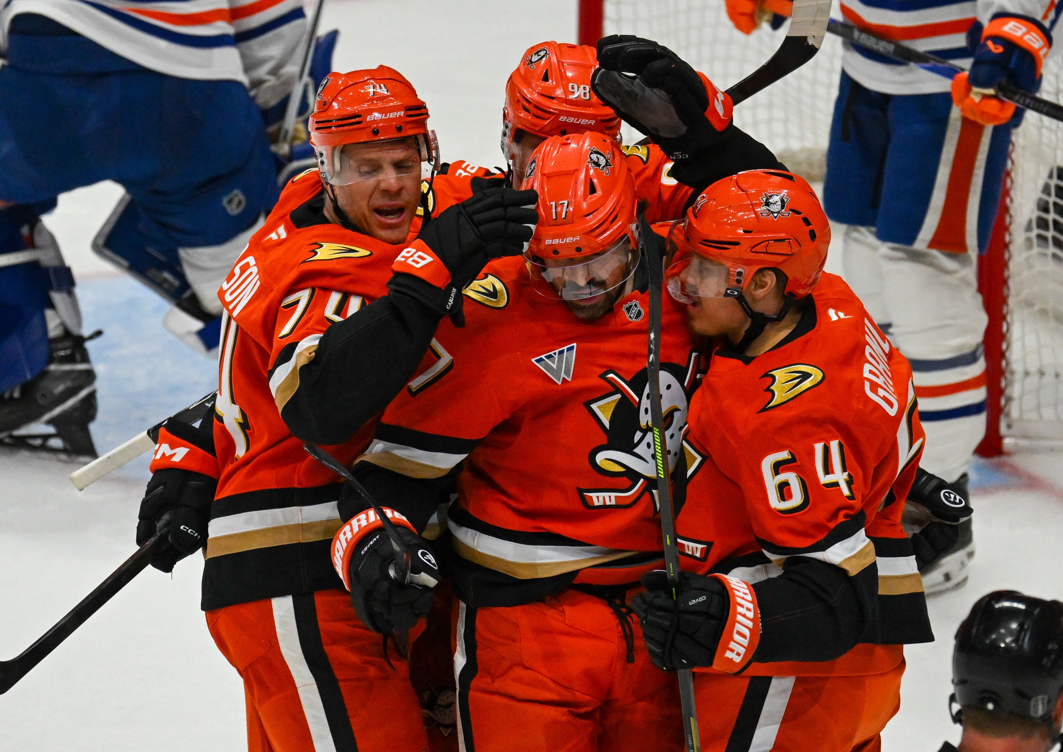 The Ducks John Carlson (74), Alex Killorn (17), and Mikael...