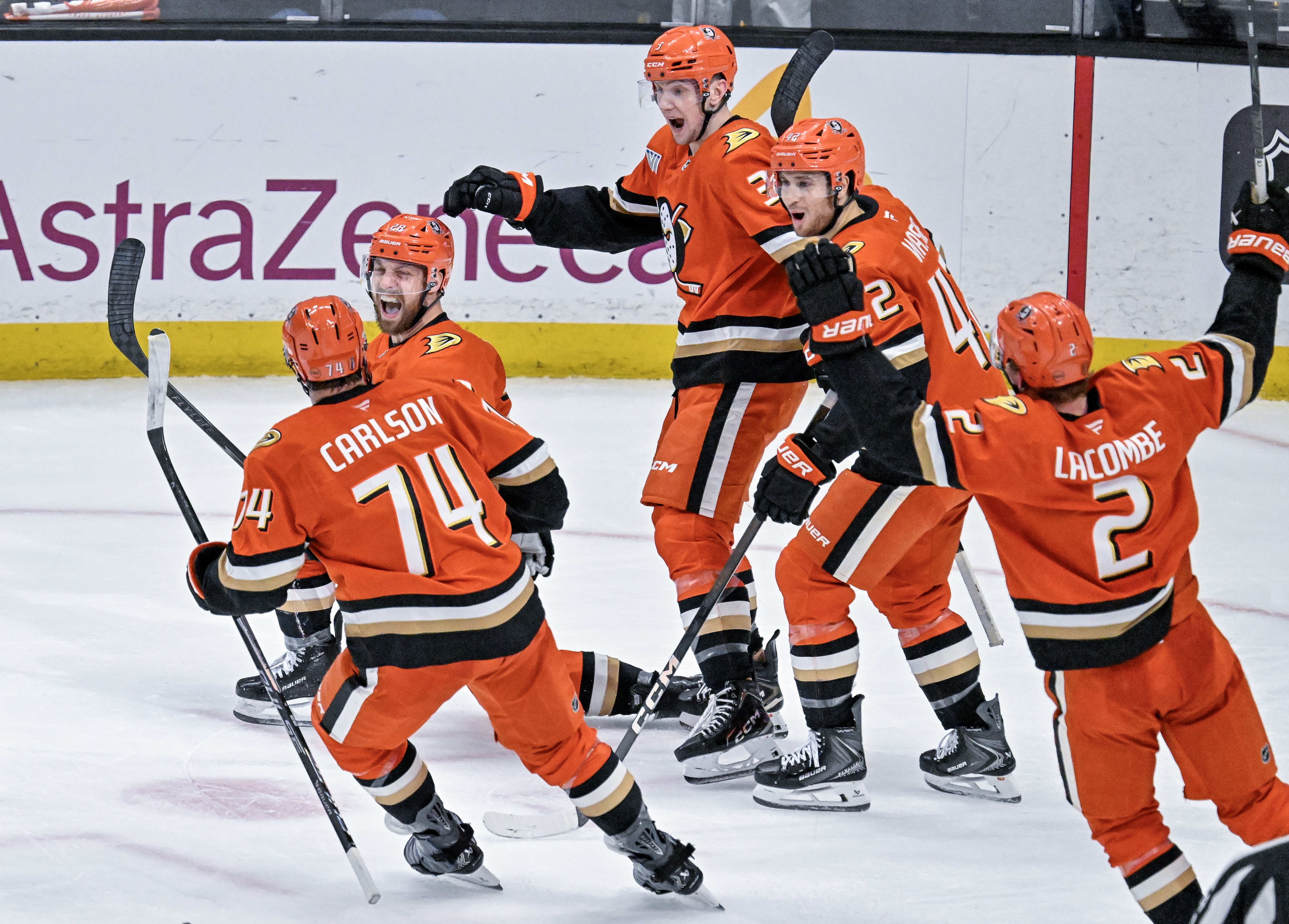 Ducks players celebrate a third period goal by Jeffrey Viel...