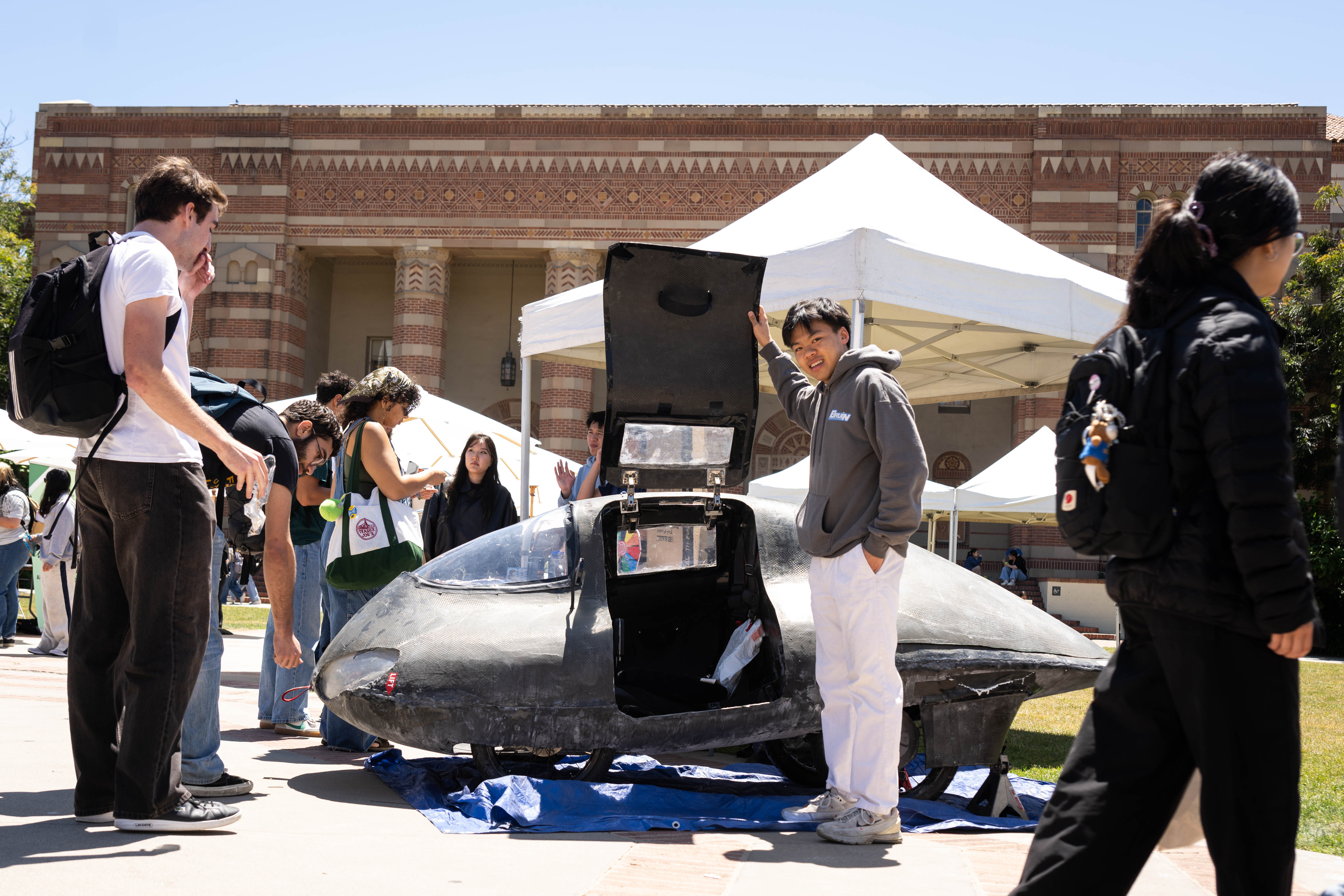 Dean Mac, 21, a mechanical engineering student, shows Bruin Racing...