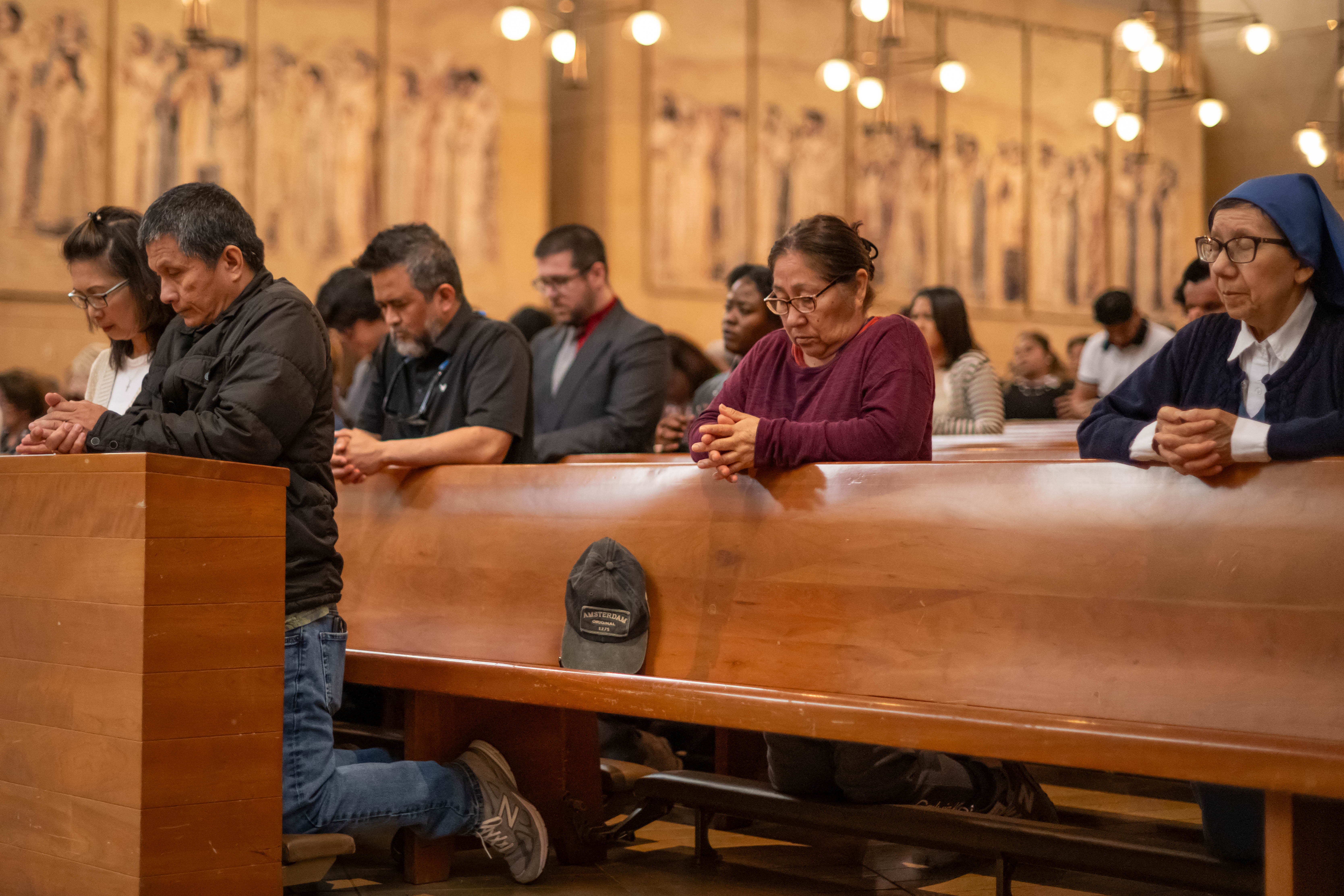 Catholics attend Good Friday service at Cathedral of Our Lady...