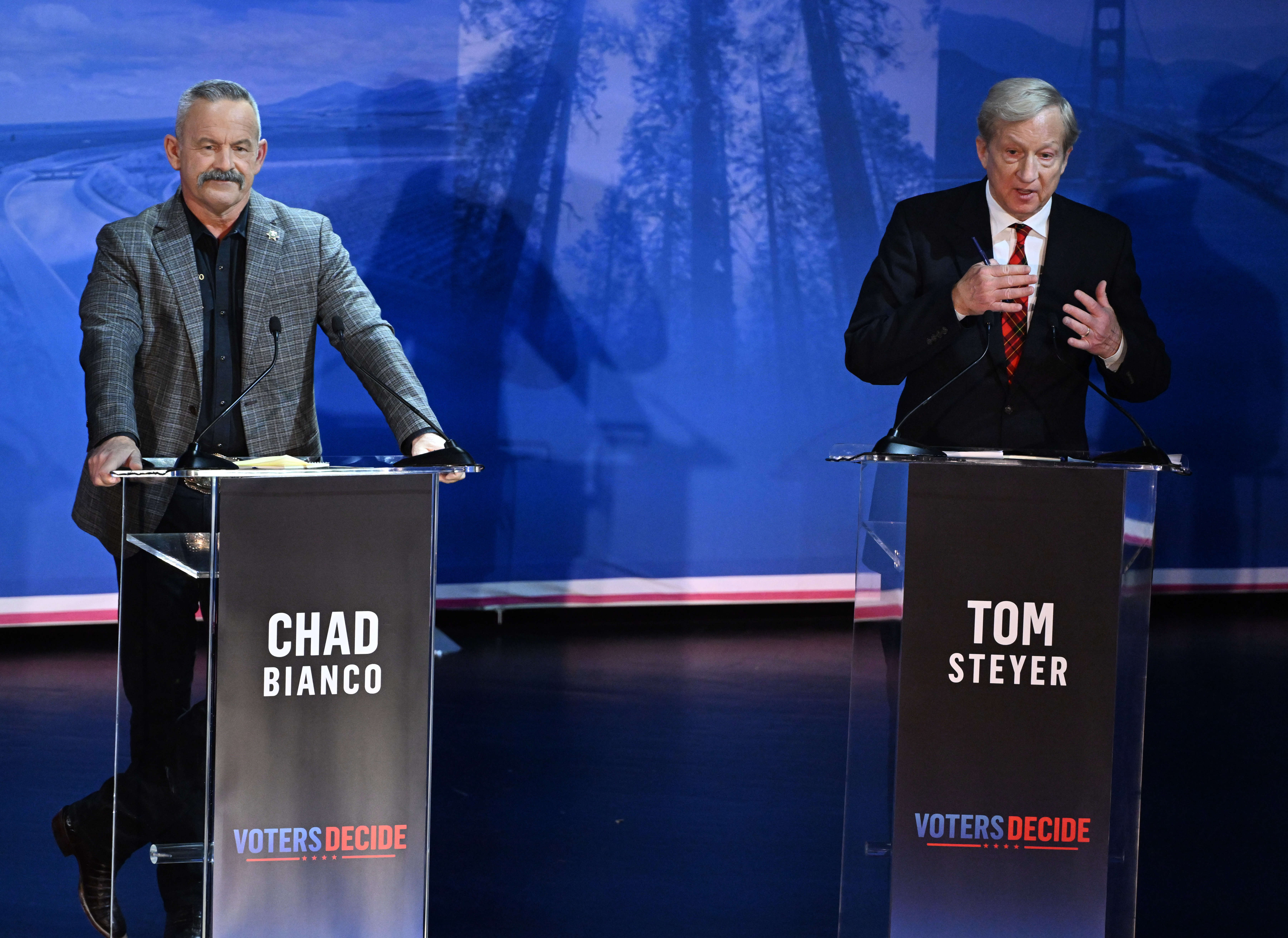 California gubernatorial candidate Tom Steyer speaks as Chad Bianco, left,...
