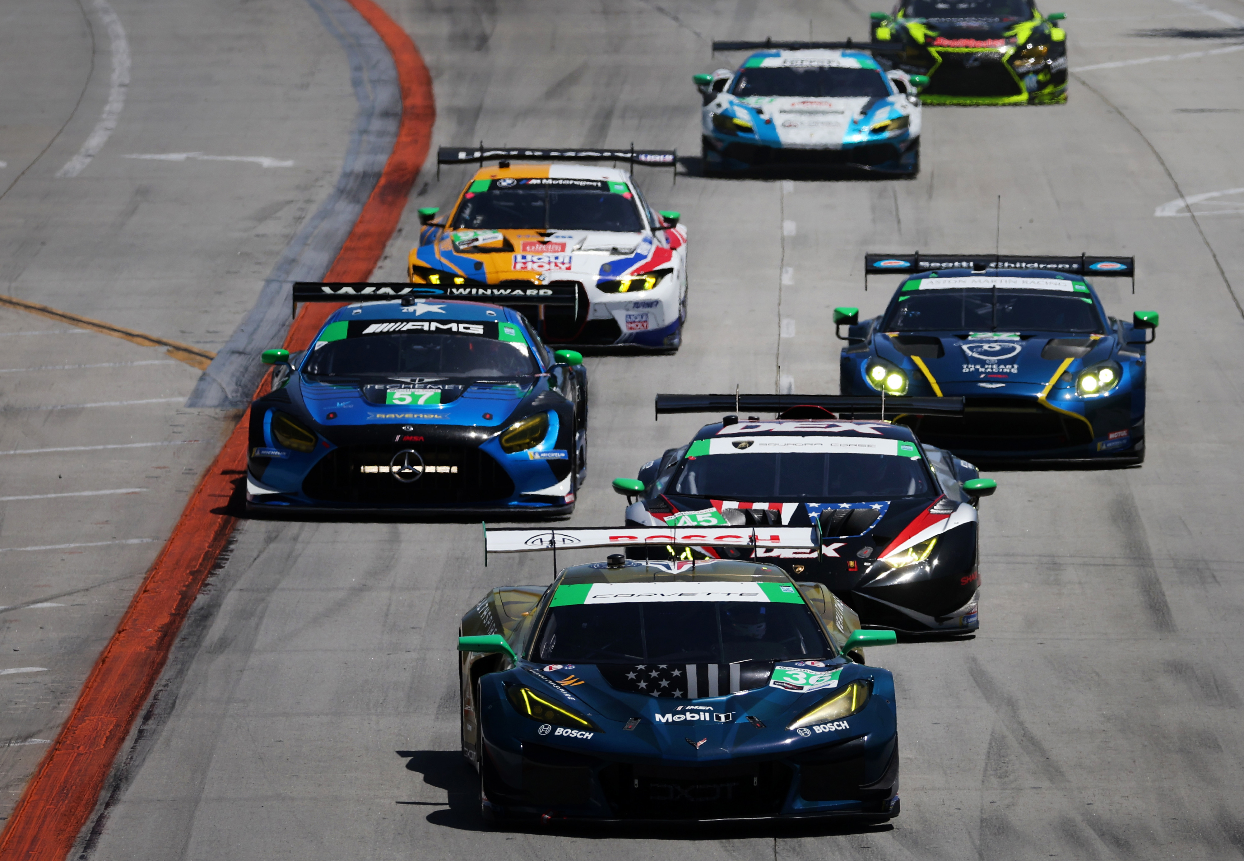 The DXDT Racing (36) car leads the GTD field into...