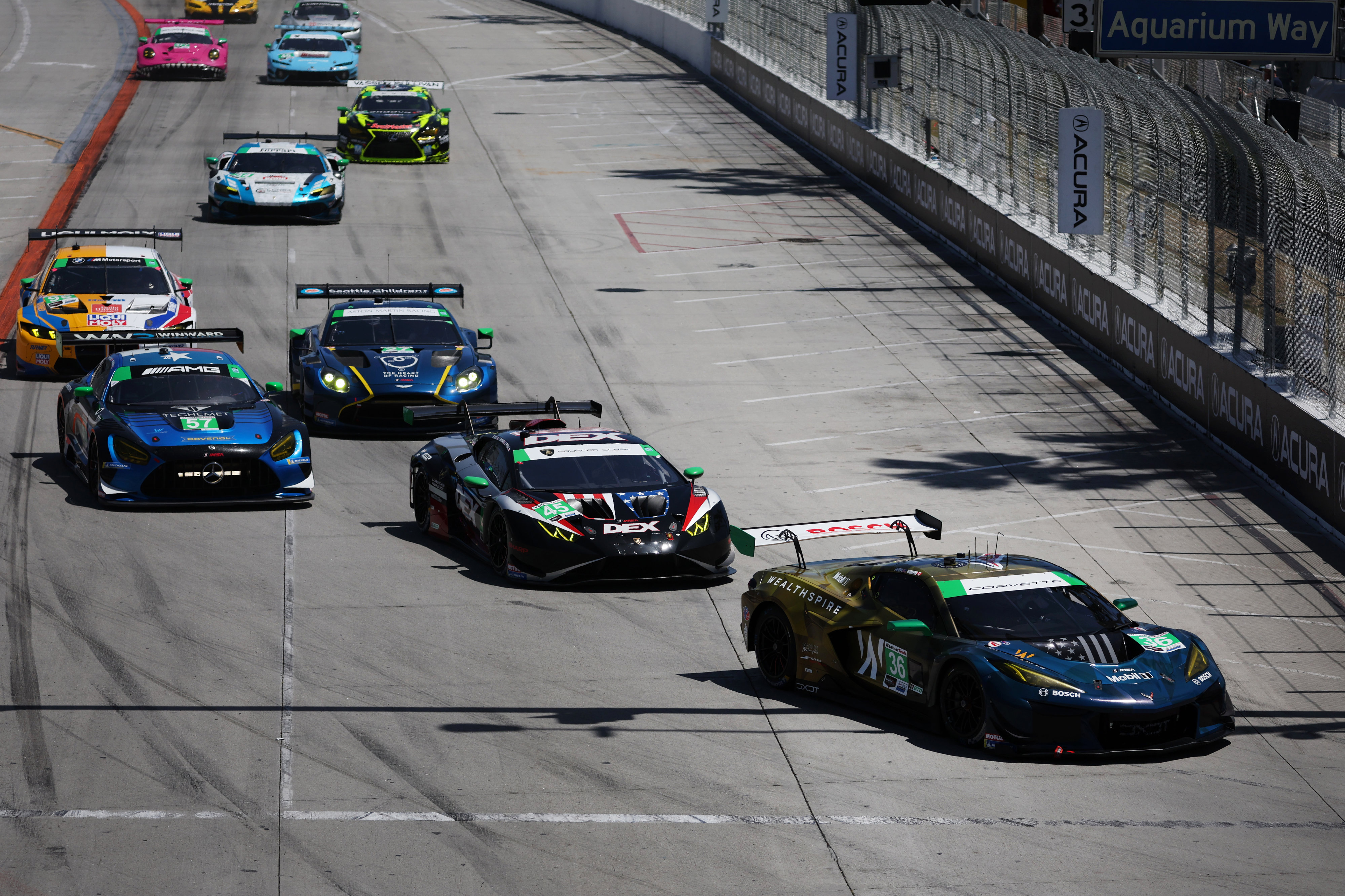 The DXDT Racing (36) car leads the GTD field into...