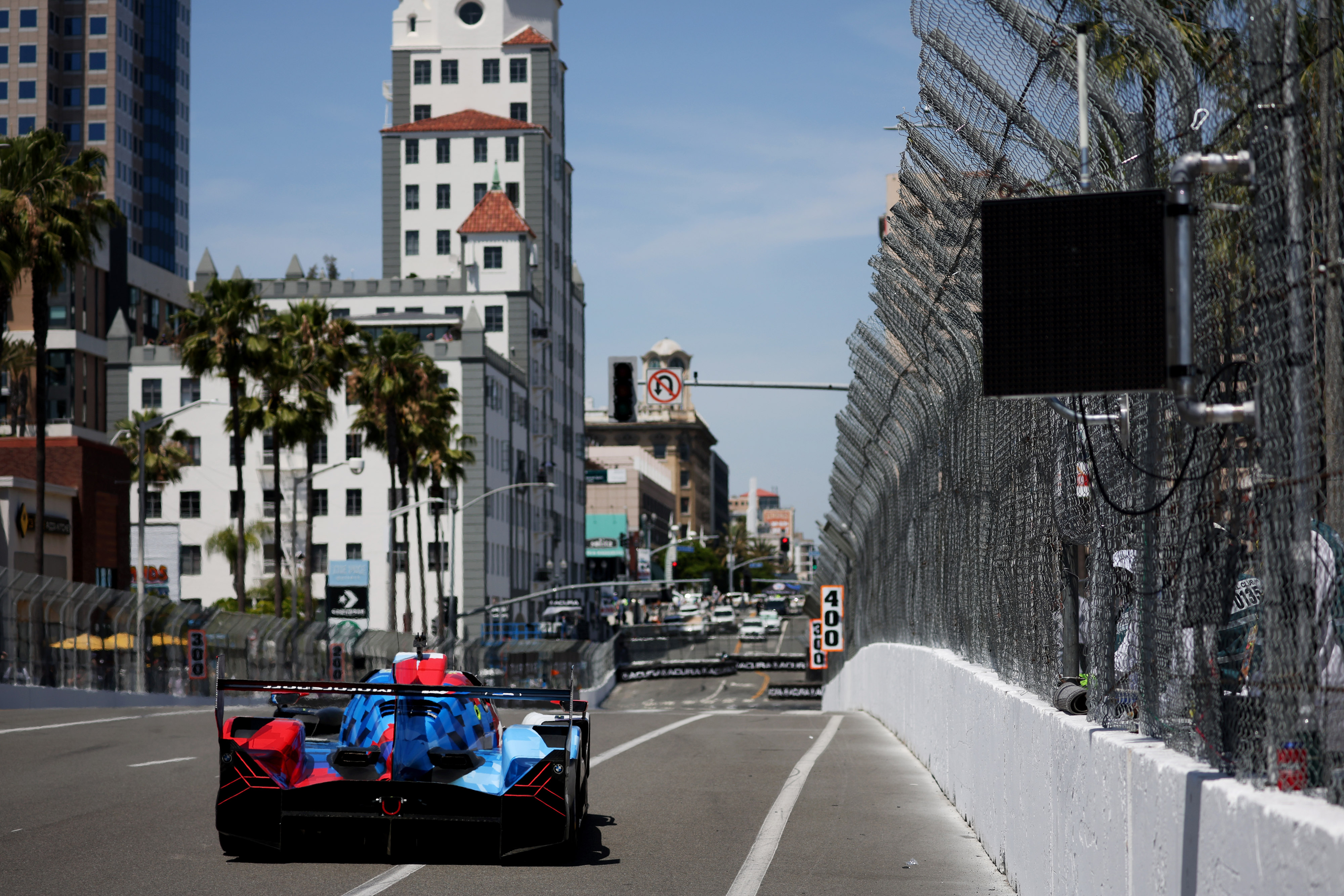 A GTP car hustles around the track in the IMSA...